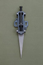 209 perimeter alarm device photographed on an OD green duck cloth canvas