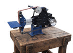 blue grinder on work bench